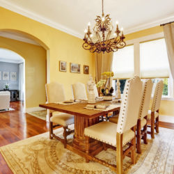bright,luxury,dining,room,with,rich,carved,wood,table